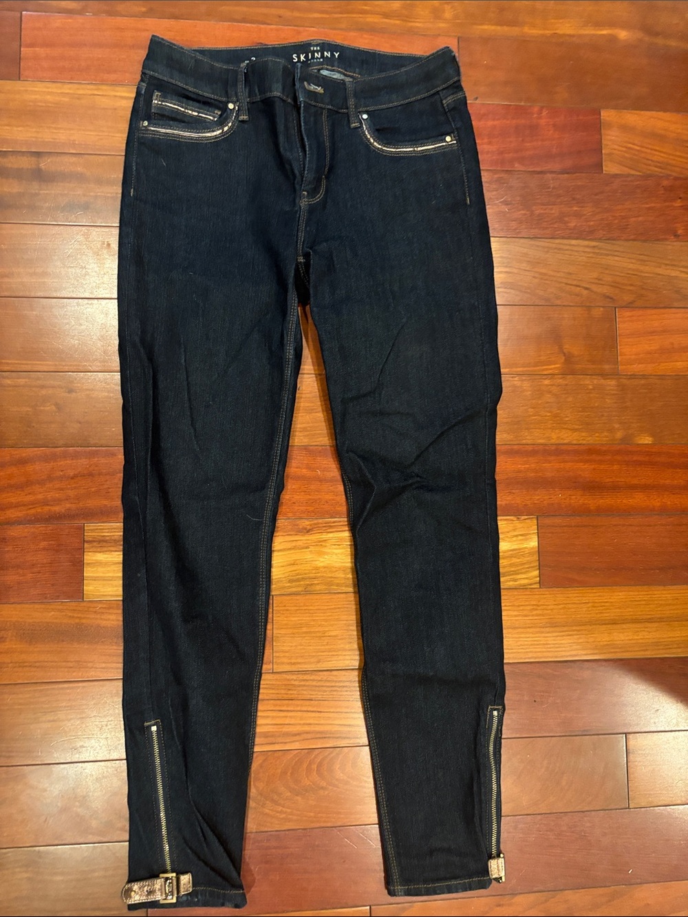 White House Black Market The Skinny Dark Wash Ankle Zip Jeans with copper accent